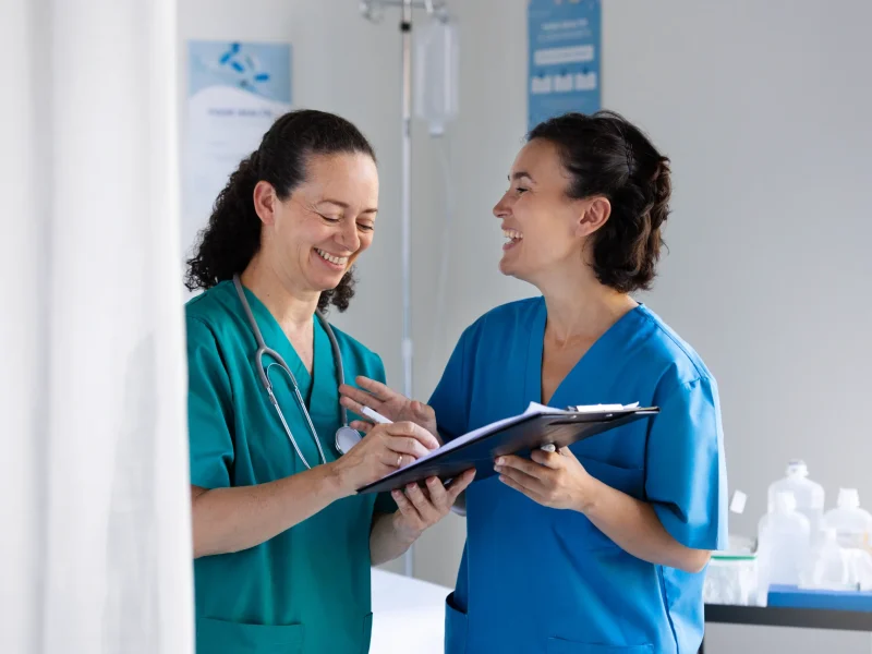 medium-shot-smiley-women-chatting-work